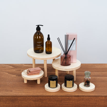 set of 3 natural wooden risers with coasters for artisan market displays

