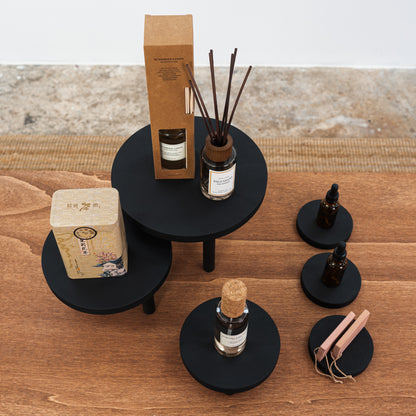black display risers for candles, jewelry, and ceramic items

