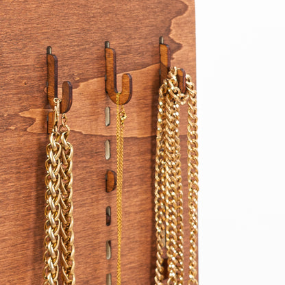 Coffe color short hooks for pegboards, offering an ideal solution for organizing products in trade shows, pop-up shops, and retail environments.