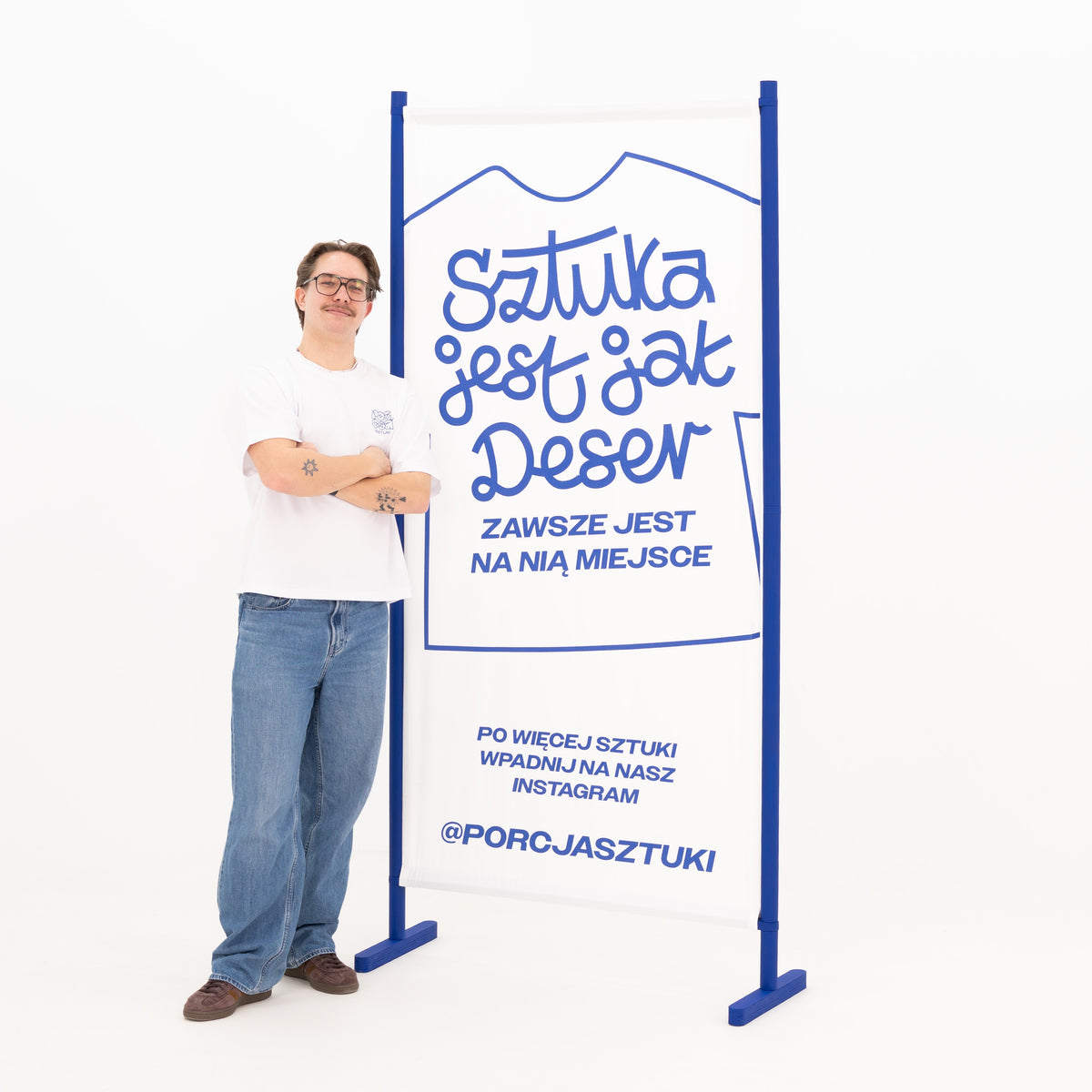Branded fabric wall shown with person for scale