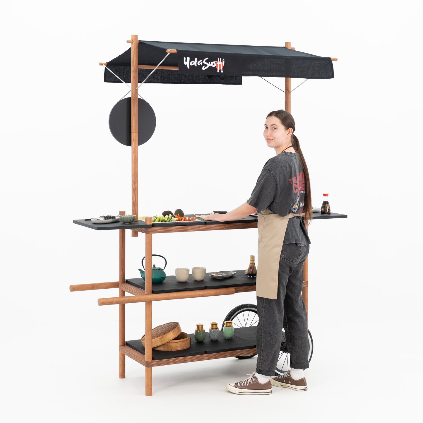Market stall cart with canopy BC-09-W-ML set up as a branded sushi bar, with a person hanging the round logo board