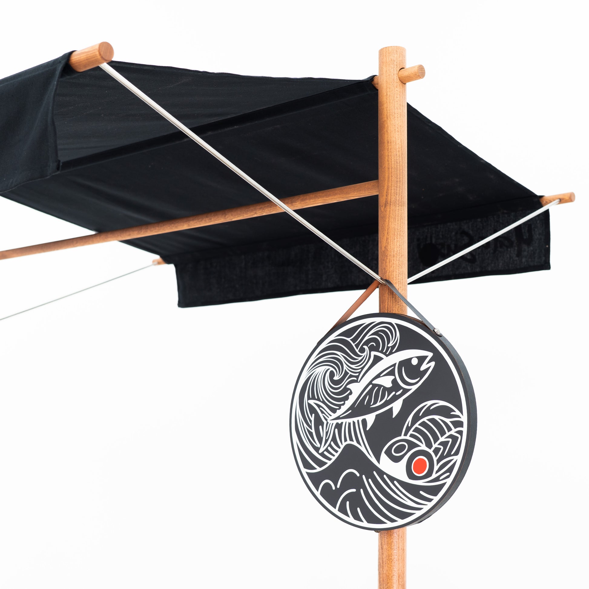 Close-up of the BC-09-W-ML canopy and round hanging logo board with custom fish artwork