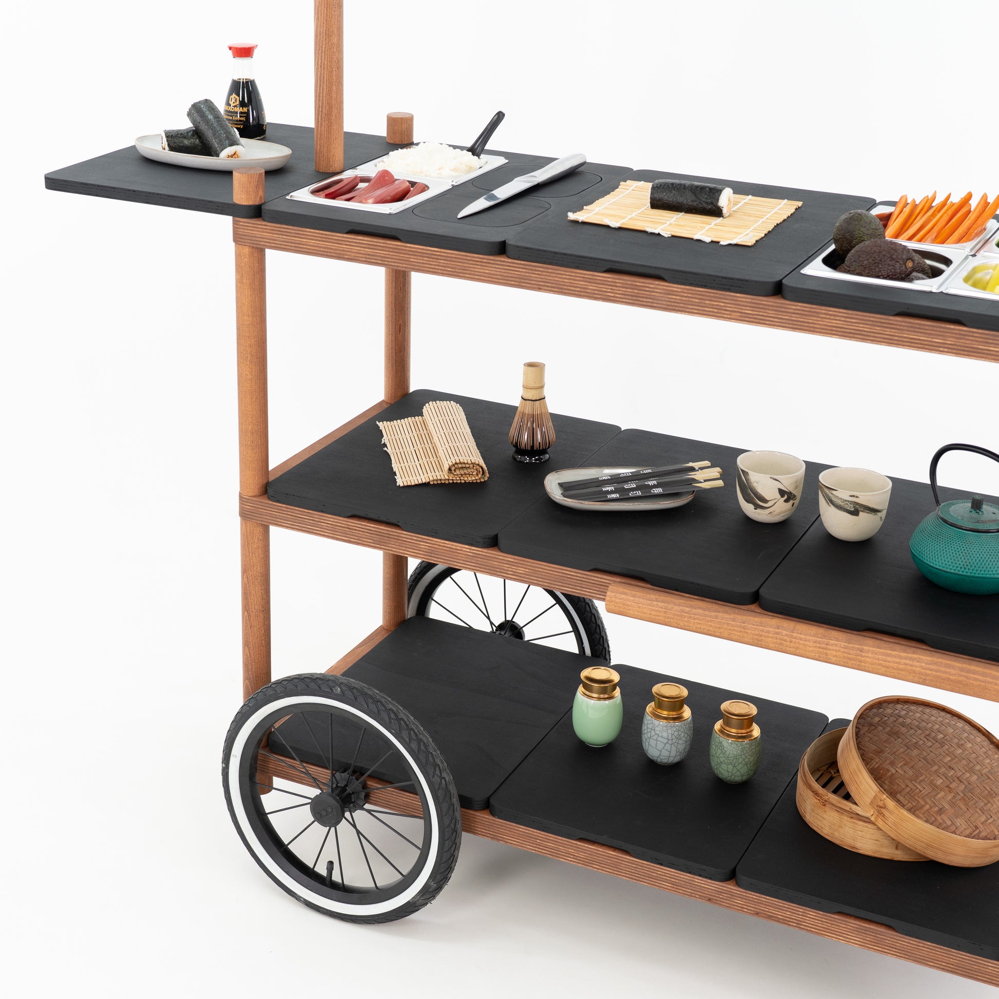 Three-tier layout of the BC-09-W-ML event cart with black countertops, spoked wheel and sushi serving props