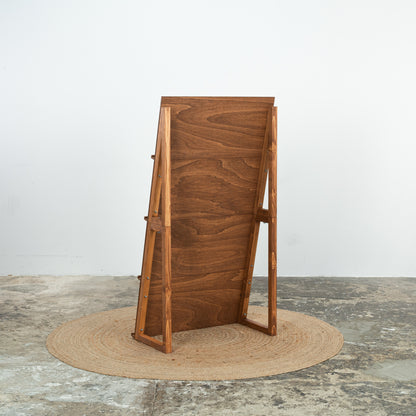 Coffee wood dual display rack with art prints and books at a trade fair