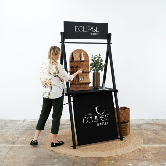 Serving station VC-01-BL in black color with front panel, reusable wooden display, market stand