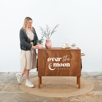 Mobile checkout stand in rich wood finish
