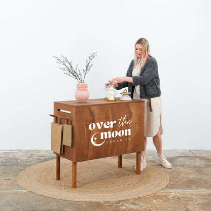 Event-ready brown checkout counter with logo space

