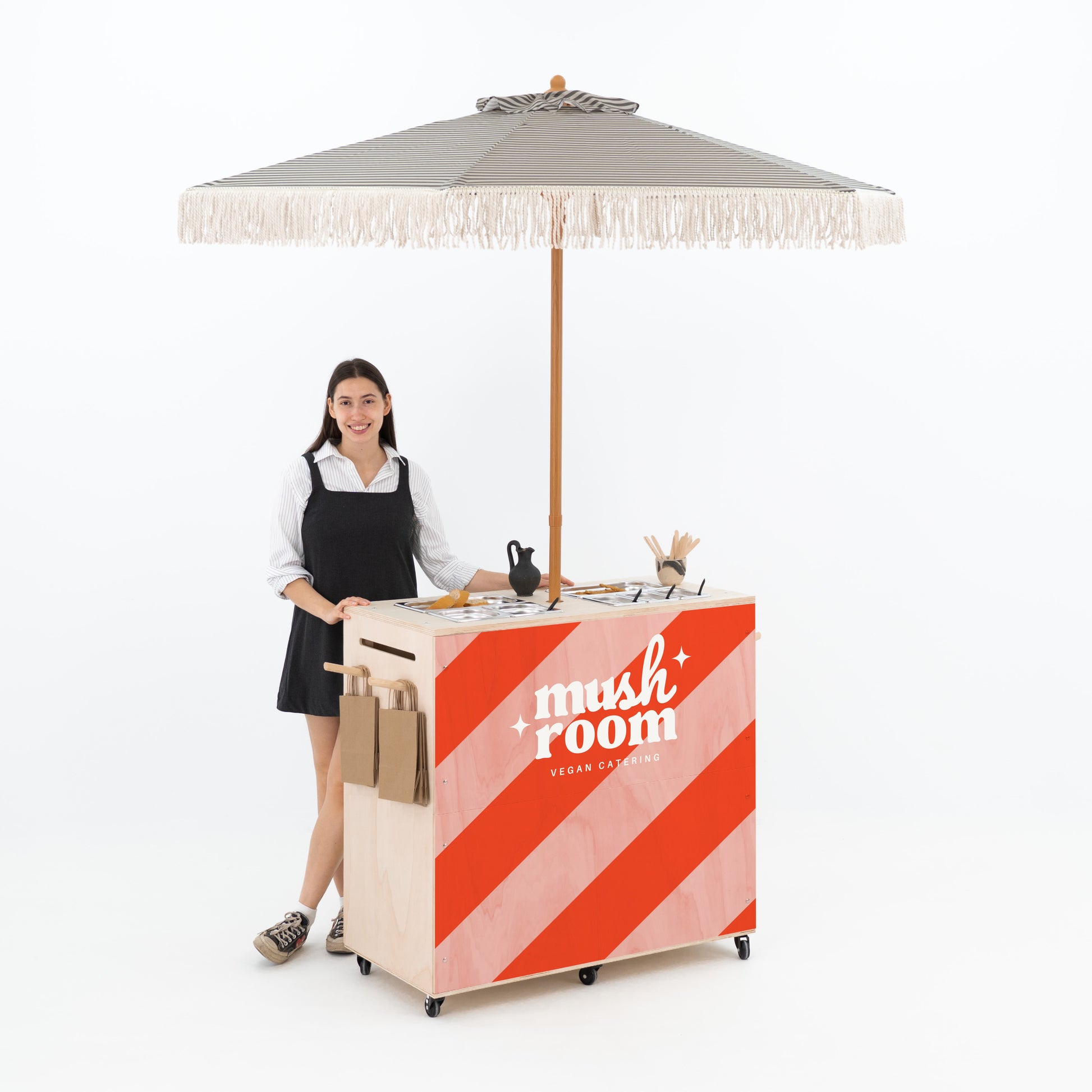 Flat-pack catering trolley featuring gastronorm inserts and umbrella holder

