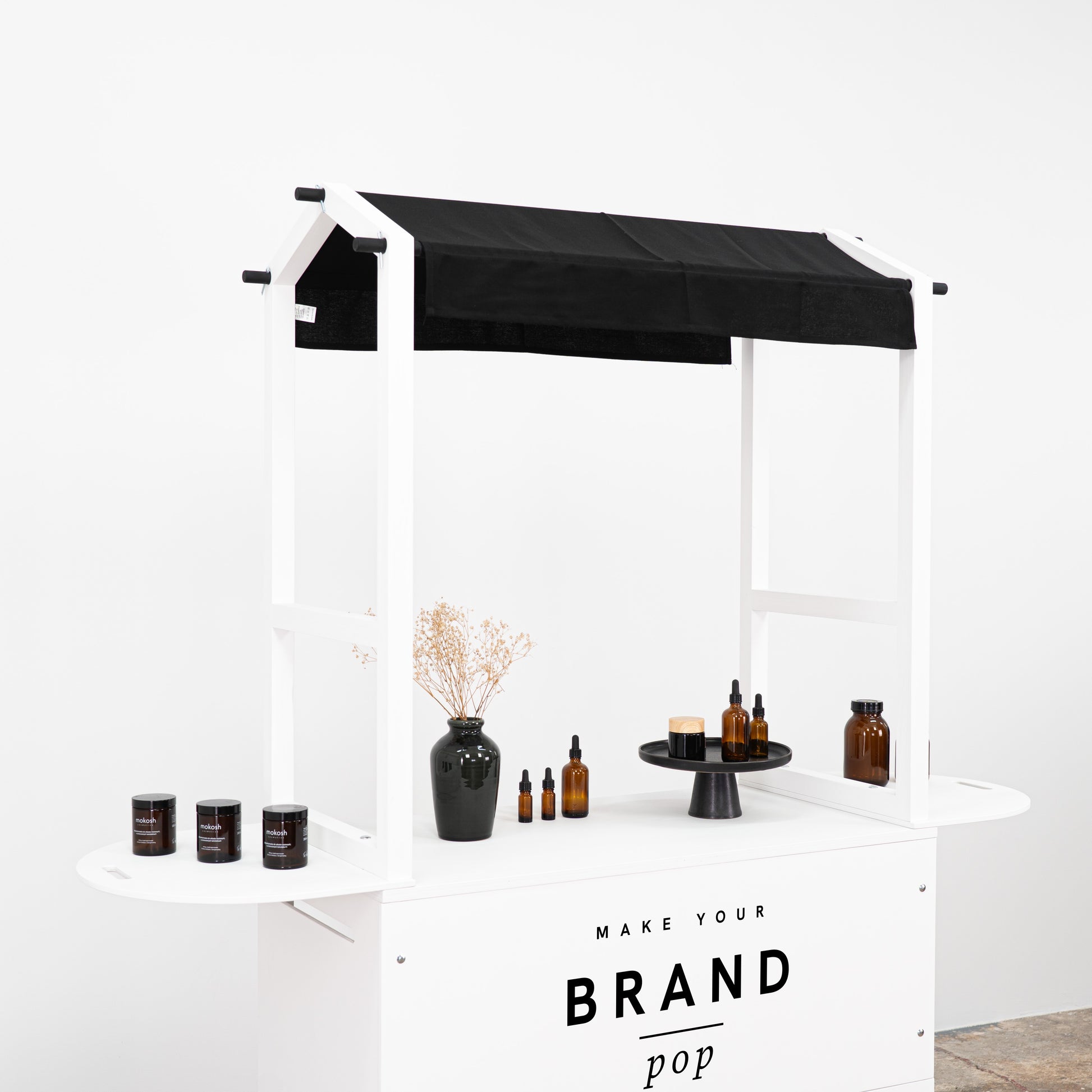 Mobile bar cart with minimalist design, ideal for creating an elegant product showcase at any event or market.