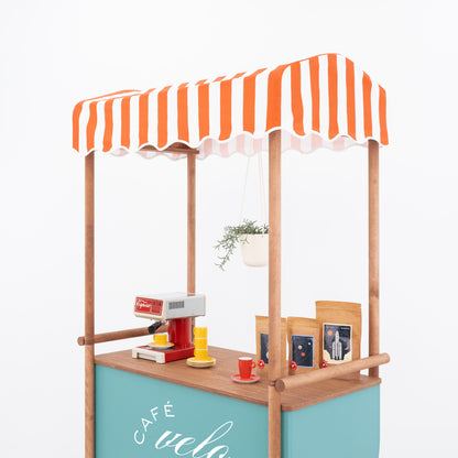 Event cart with striped canopy styled as a café setup, front angle view