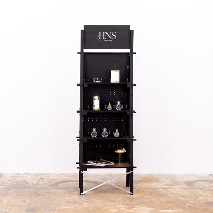 Compact black pegboard for mobile pop-up retail spaces