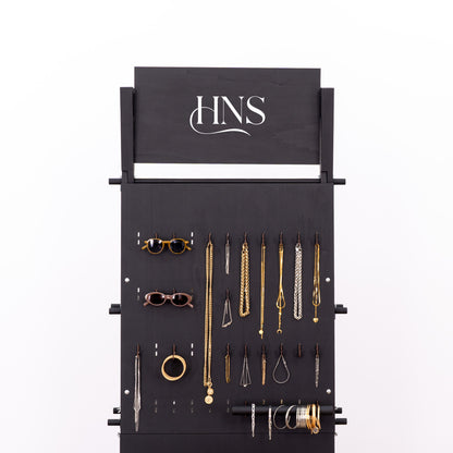 Vertical pegboard wall unit for displaying small retail collections