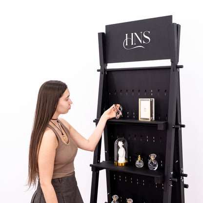 Back view of black display stand showing additional storage shelves