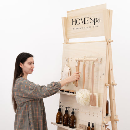 Natural VP-01-AF pegboard display stand with adjustable hooks and storage shelves, ideal for showcasing various products in clean, modern spaces.
