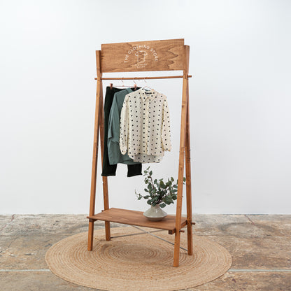 Custom retail stand for garments and shoes with personalized signboard