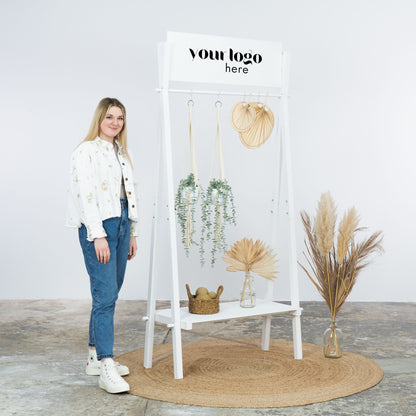 White rack with robe, slippers and styled shelf display