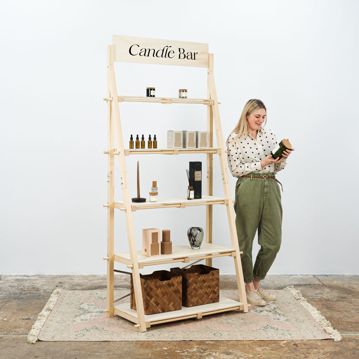 Portable wooden shelving unit for trade shows and exhibitions, easy-to-assemble and collapsible design.