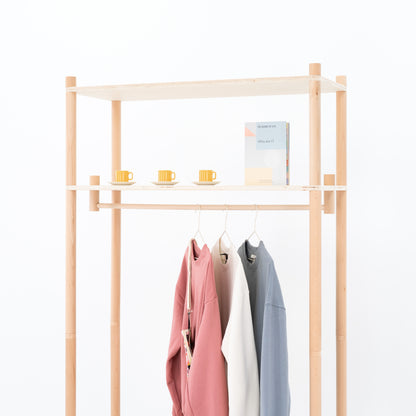 Back view of modular clothing rack with cotton panel