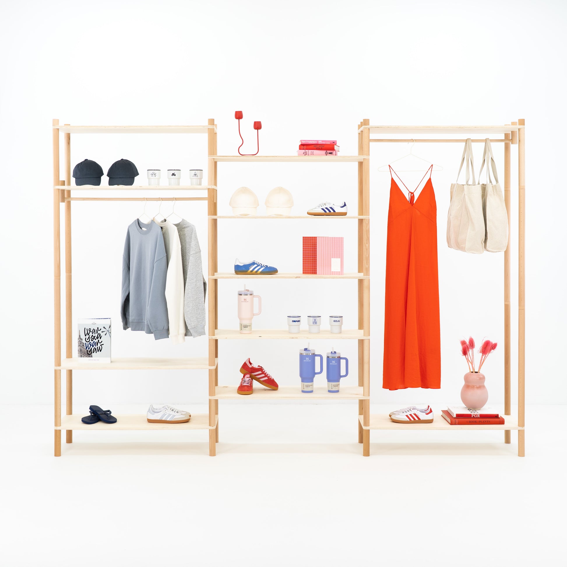 Triple modular shelving unit in natural wood finish