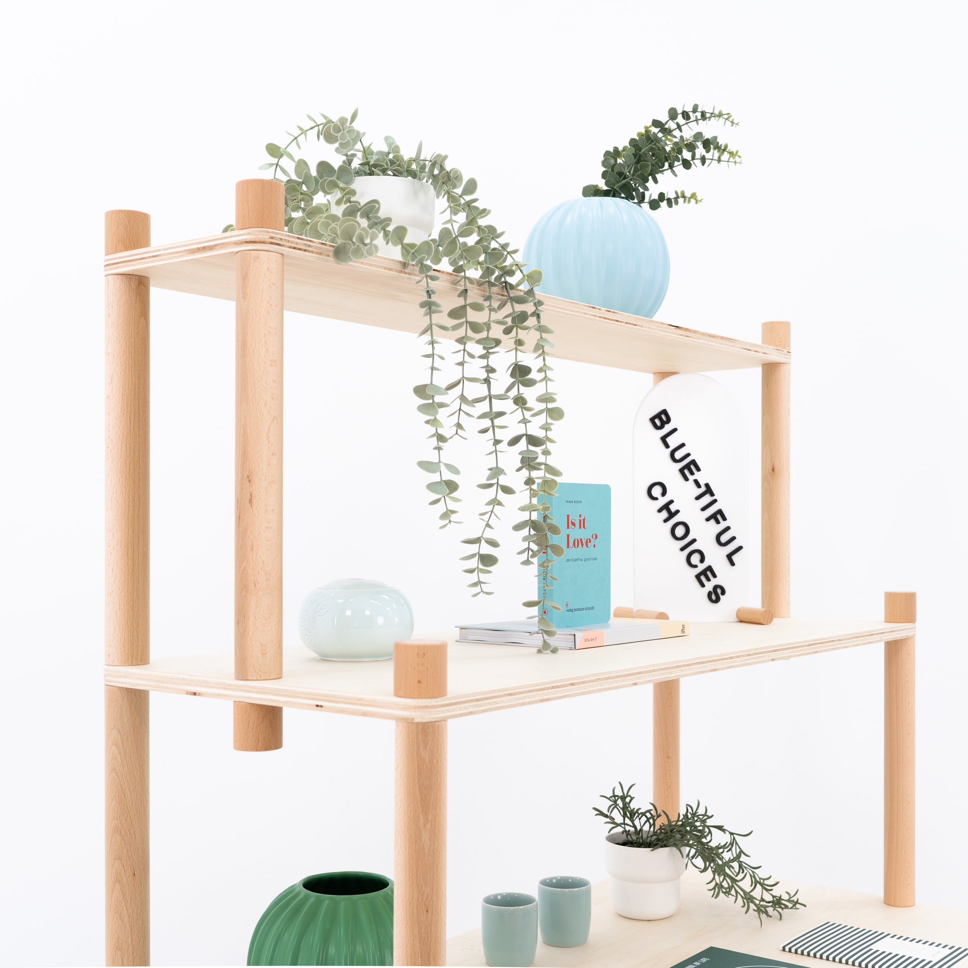 Close-up of modular bamboo shelf structure and product layout