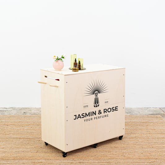 Wooden portable exhibition counter with a natural finish and lockable storage, ideal for retail and events.
