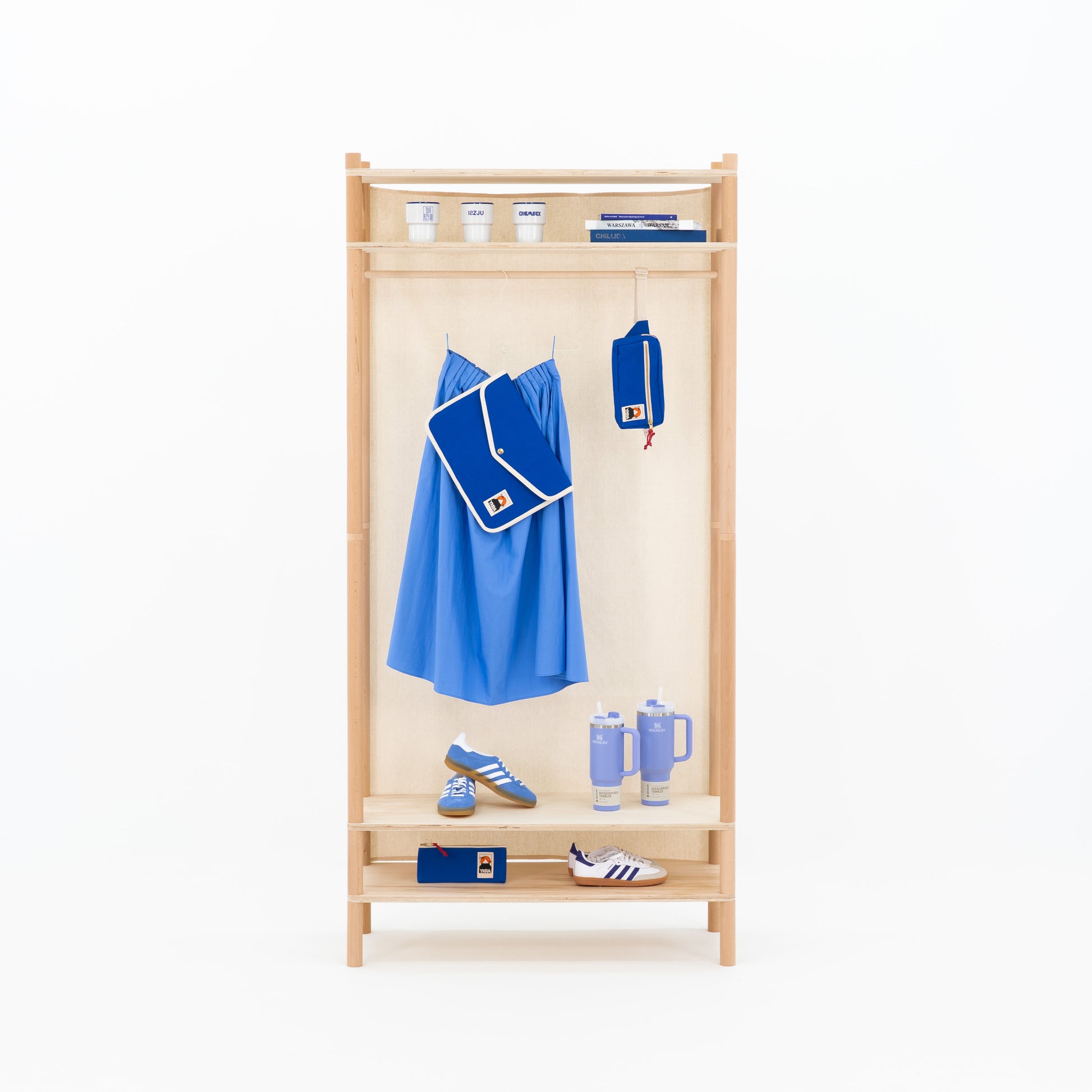 Modular bamboo clothes rail for boutique visual merchandising