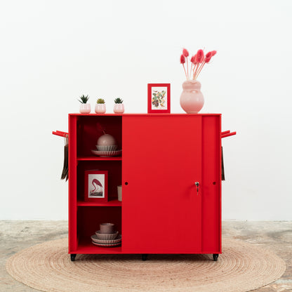 Red cashier counter with shelving and floral display
