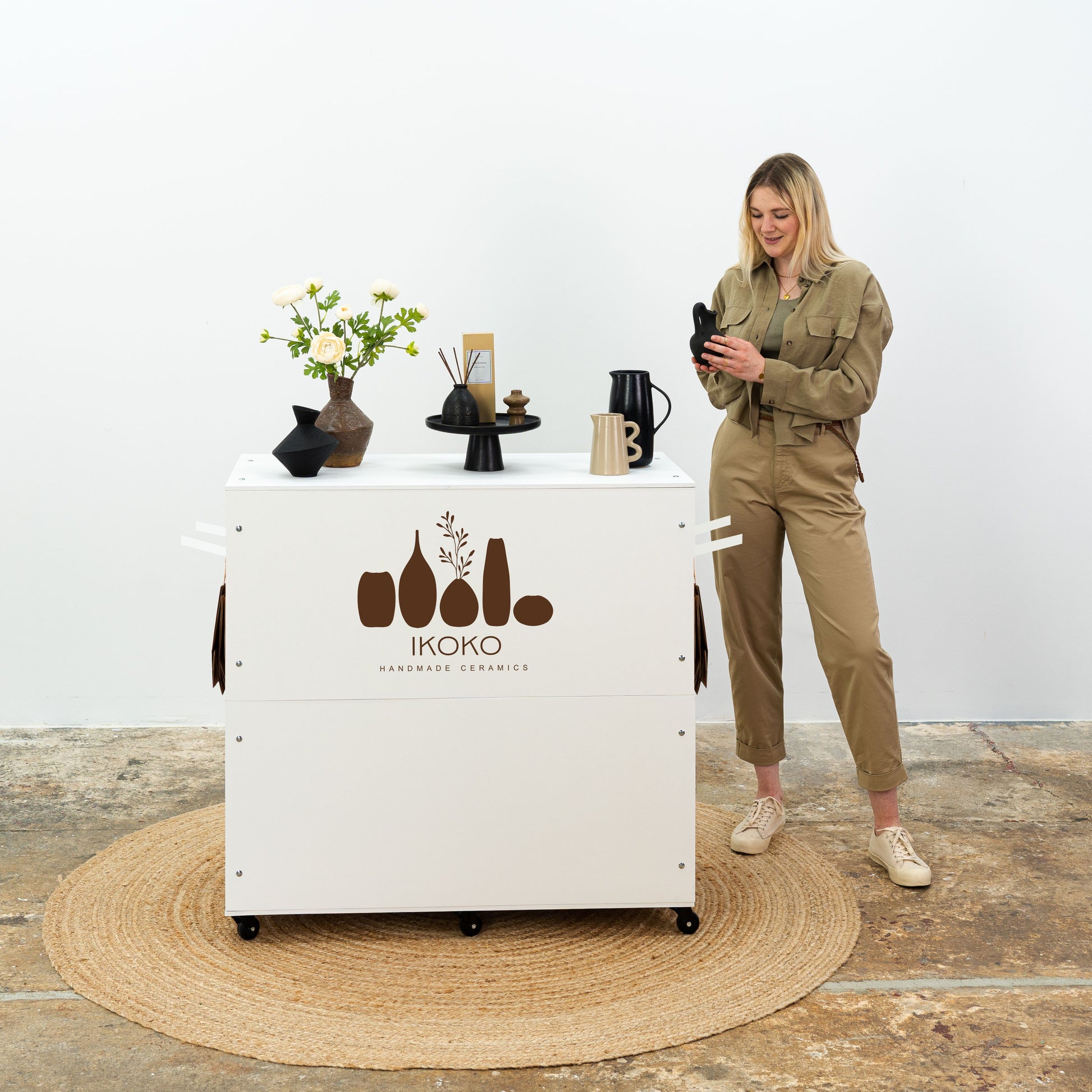 Compact event counter with shelves and lockable sliding doors